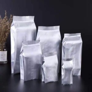 Four side seal coffee sachet on a high barrier foil laminate for single serve ground coffee and coffee sticks