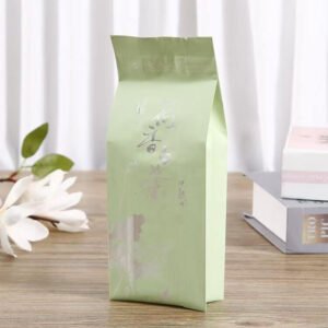 Four side seal tea sachet in a metallised barrier laminate for single serve tea and herbal blend portions