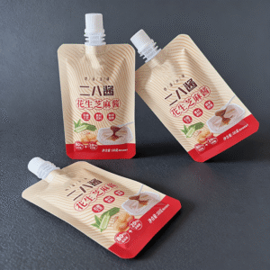 Three side seal sachet fitted with a small spout for liquid single-serve dosing